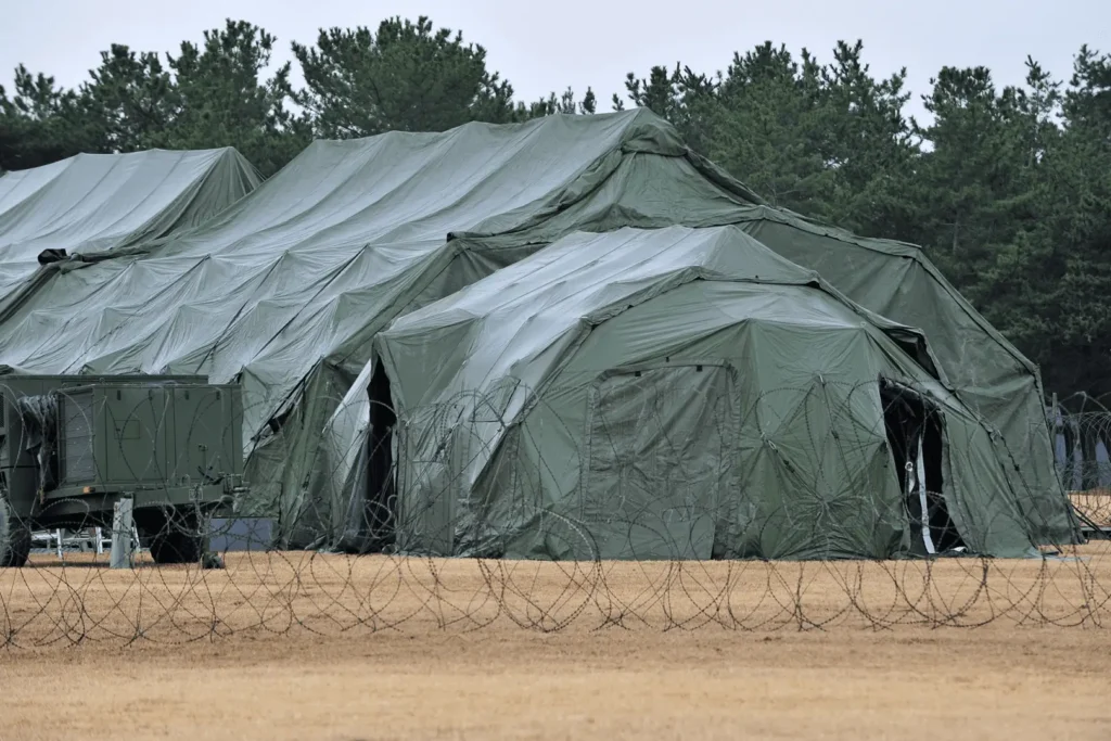 A large tent is being used to cover the ground.
