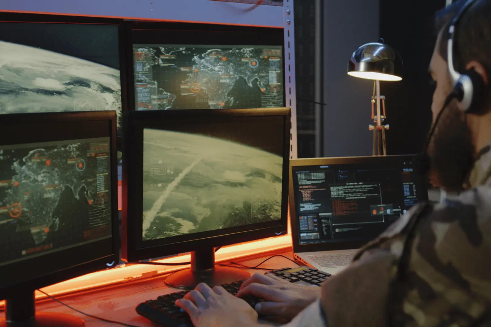 A person is working on a computer at night.